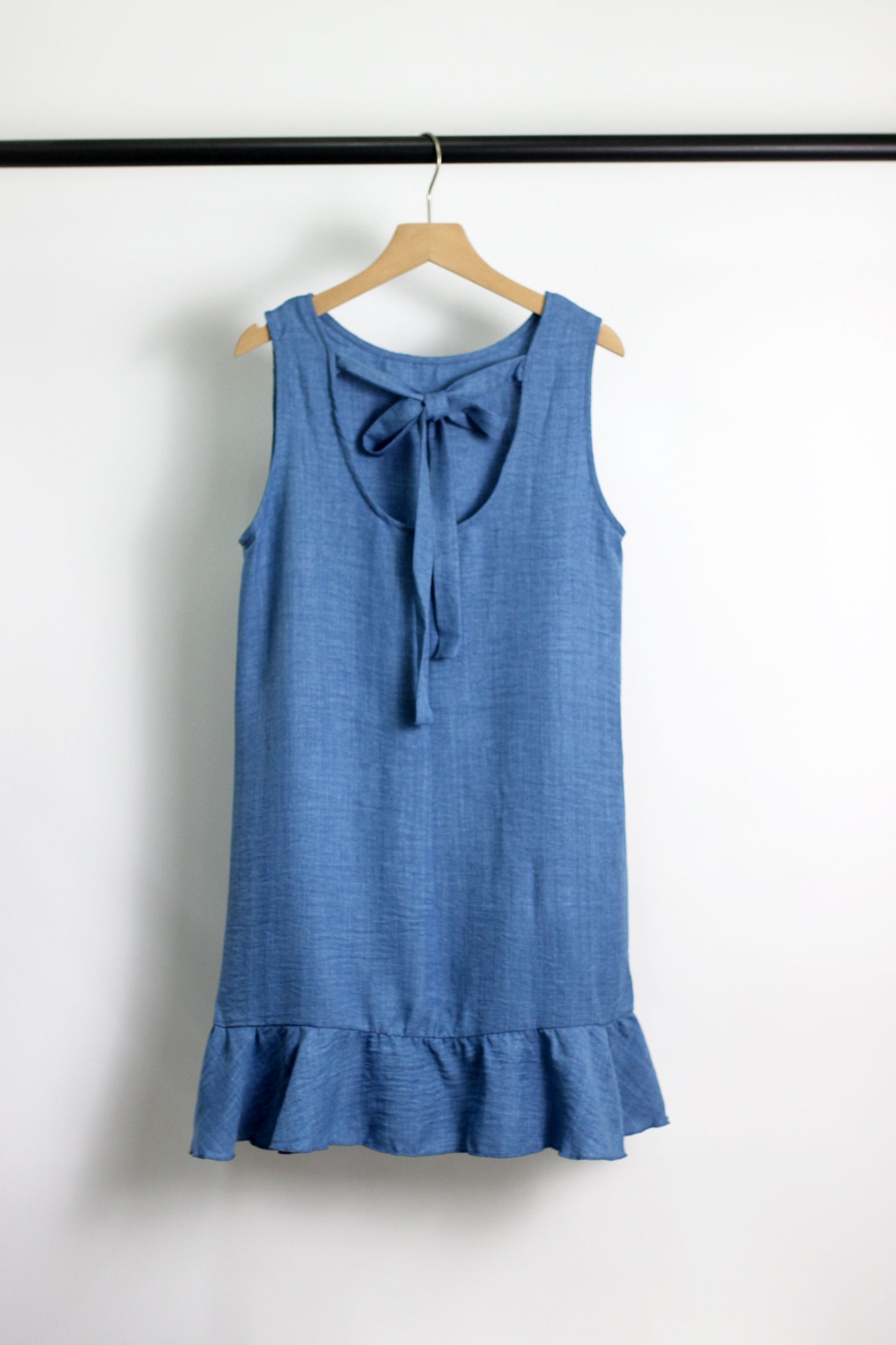 D2502GS21850 - Sleeveless Ruffle Hem Shift Dress with Back Bow Tie